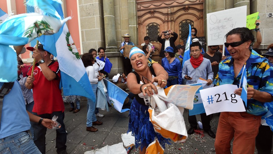 Demostrators protest in front of the Electoral Supreme Court (TSE) in Guatemala City on September 3, 2015. Guatemalan ex-president Otto Perez appeared in court Thursday over corruption allegations, hours after he resigned following unprecedented protests that have upended the political scene three days from elections. AFP PHOTO/ Rodrigo ARANGUA (Photo credit should read RODRIGO ARANGUA/AFP/Getty Images)
