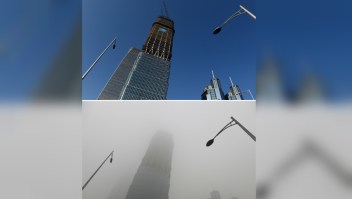 This combination image of two photographs taken on December 3, 2015 (top) and two days earlier on December 1 (bottom) shows a skyscraper under clear skies and in heavy pollution, as seen in the central business district in Beijing. The skies cleared in Beijing on December 2 and 3, after being swathed in choking smog that was nearly 24 times safe levels earlier in the week. AFP PHOTO / GREG BAKER / AFP / GREG BAKER (Photo credit should read GREG BAKER/AFP/Getty Images)