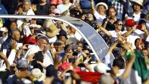 Pope Francis waves at the crowd from the popemobile on his way to the Guadalupe Basilica in Mexico City on February 13, 2016. Pope Francis urged Mexican bishops Saturday to take on drug trafficking with "prophetic courage," warning that it represents a moral challenge to society and the church. AFP PHOTO / Pedro PARDO / AFP / Pedro PARDO (Photo credit should read PEDRO PARDO/AFP/Getty Images)