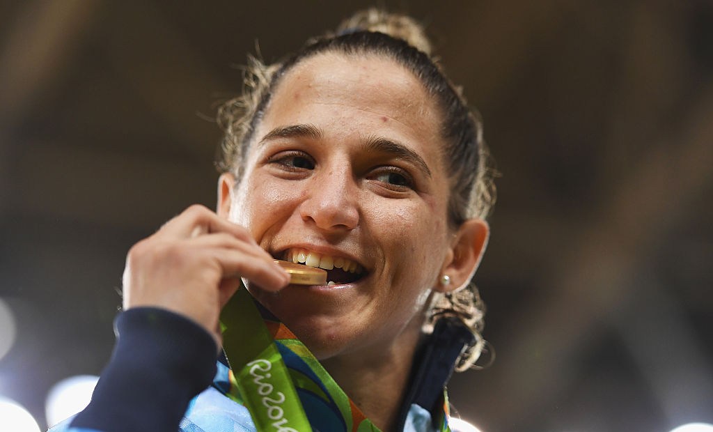 RIO DE JANEIRO, BRAZIL - AUGUST 06: Paula Pareto of Argentina celebrates winning the gold medal in the Women's -48 kg Judo on Day 1 of the Rio 2016 Olympic Games at Carioca Arena 2 on August 6, 2016 in Rio de Janeiro, Brazil. (Photo by Laurence Griffiths/Getty Images)