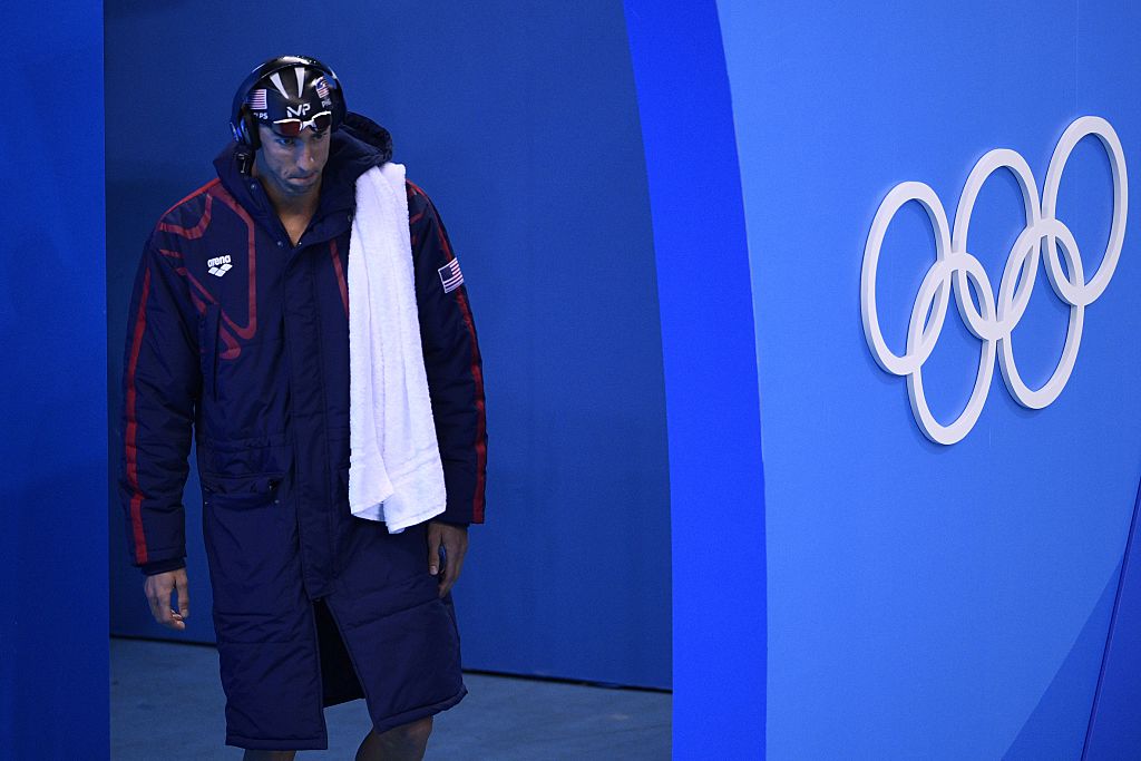 USA's Michael Phelps arrives to compete in the Men's 200m Butterfly Semifinal during the swimming event at the Rio 2016 Olympic Games at the Olympic Aquatics Stadium in Rio de Janeiro on August 8, 2016. / AFP / Martin BUREAU (Photo credit should read MARTIN BUREAU/AFP/Getty Images)