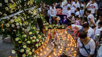 Candles and flowers are seen in an altar at the feet of a statue of Mexican composer and singer Alberto Aguilera, known as "Juan Gabriel" in Paracuaro, Michoacan state, Mexico on August 29, 2016. Mexico and the music world on Monday mourned the death of legendary singer Juan Gabriel, who touched millions with wrenching ballads of love and loneliness as he rose from the rough streets of Ciudad Juarez to a world stage. / AFP / ENRIQUE CASTRO (Photo credit should read ENRIQUE CASTRO/AFP/Getty Images)