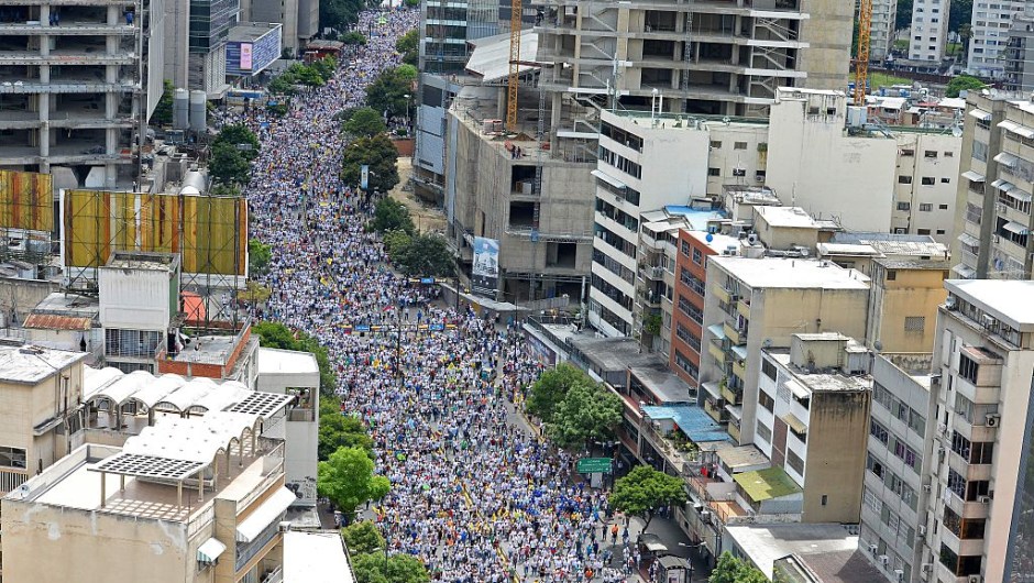 Opposition activists march in Caracas, on September 1, 2016. Venezuela's opposition and government head into a crucial test of strength Thursday with massive marches for and against a referendum to recall President Nicolas Maduro that have raised fears of a violent confrontation. / AFP / FEDERICO PARRA (Photo credit should read FEDERICO PARRA/AFP/Getty Images)