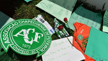 People pay tribute to the players of Brazilian team Chapecoense Real who were killed in a plane accident in the Colombian mountains, at the club's Arena Conda stadium in Chapeco, in the southern Brazilian state of Santa Catarina, on November 29, 2016. Players of the Chapecoense were among 81 people on board the doomed flight that crashed into mountains in northwestern Colombia, in which officials said just six people were thought to have survived, including three of the players. Chapecoense had risen from obscurity to make it to the Copa Sudamericana finals scheduled for Wednesday against Atletico Nacional of Colombia. / AFP / Nelson ALMEIDA (Photo credit should read NELSON ALMEIDA/AFP/Getty Images)