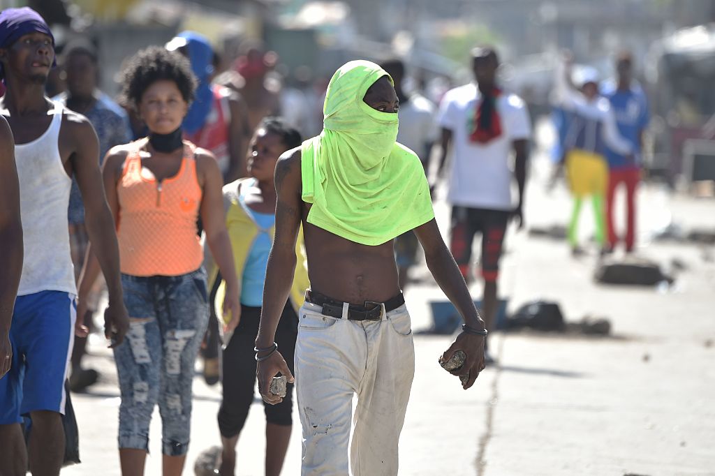 Supporters of presidential candidate Maryse Narcisse protest in the neighborhood of La Saline, in the Haitian capital Port-au-Prince, on November 29, 2016. Haitian presidential candidate Jude Celestin, who lost the country's election to opponent Jovenel Moise according to preliminary results, challenged the outcome Tuesday, alleging it was due to "cheating." "We are saying there was cheating and we will see who cheated," Celestin told AFP, without naming Moise directly. / AFP / HECTOR RETAMAL (Photo credit should read HECTOR RETAMAL/AFP/Getty Images)