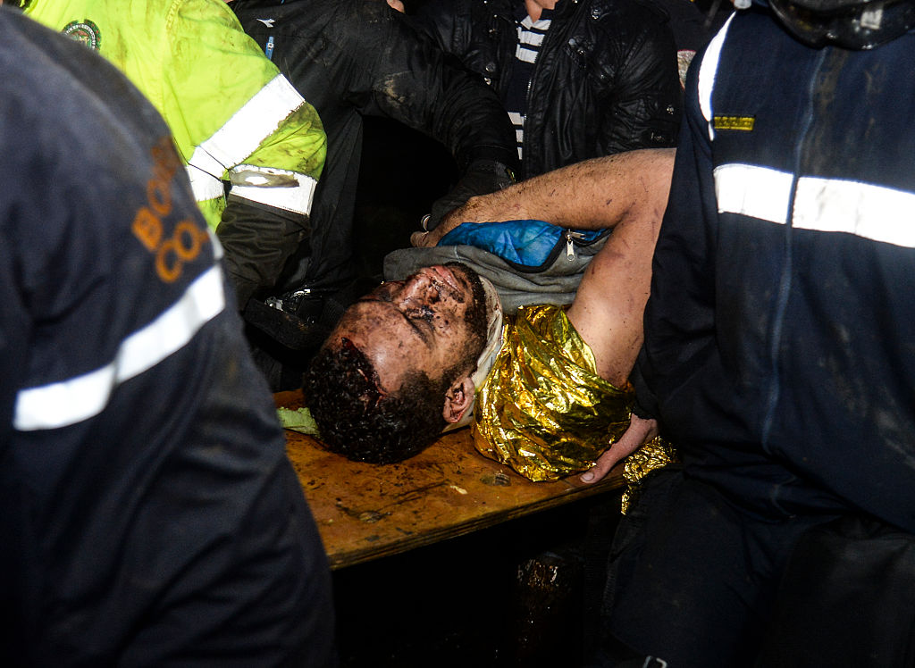 Brazil's Chapecoense player Helio Neto is helped by paramedics in la Union, Antioquia Department on November 29, 2016 after being rescued from the wreckage of the LAMIA airlines charter that crashed in the mountains of Cerro Gordo, municipality of La Union, Colombia, carrying the whole Brazilian team. A charter plane carrying the Brazilian football team crashed in the mountains in Colombia late Monday, killing as many as 75 people, officials said. / AFP / STR / Raul ARBOLEDA (Photo credit should read RAUL ARBOLEDA/AFP/Getty Images)