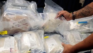 NEW YORK, NEW YORK - SEPTEMBER 23: A law enforcement official organizes bags of heroin to be displayed before a press conference regarding a major drug bust, at the office of the New York Attorney General, September 23, 2016 in New York City. New York State Attorney General Eric Scheiderman's office announced Friday that authorities in New York state have made a record drug bust, seizing 33 kilograms of heroin and 2 kilograms of fentanyl. According to the attorney general's office, it is the largest seizure in the 46 year history of New York's Organized Crime Task Force. Twenty-five peopole living in New York, Massachusetts, Pennsylvania, Arizona and New Jersey have been indicted in connection with the case. (Photo by Drew Angerer/Getty Images)