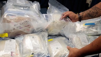 NEW YORK, NEW YORK - SEPTEMBER 23: A law enforcement official organizes bags of heroin to be displayed before a press conference regarding a major drug bust, at the office of the New York Attorney General, September 23, 2016 in New York City. New York State Attorney General Eric Scheiderman's office announced Friday that authorities in New York state have made a record drug bust, seizing 33 kilograms of heroin and 2 kilograms of fentanyl. According to the attorney general's office, it is the largest seizure in the 46 year history of New York's Organized Crime Task Force. Twenty-five peopole living in New York, Massachusetts, Pennsylvania, Arizona and New Jersey have been indicted in connection with the case. (Photo by Drew Angerer/Getty Images)
