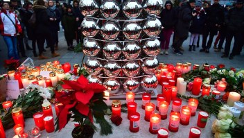 Candles are lit on December 20, 2016 at a makeshift memorial in front of the Kaiser-Wilhelm-Gedaechtniskirche (Kaiser Wilhelm Memorial Church) in Berlin, where a truck crashed the day before into a Christmas market. Twelve people were killed and almost 50 wounded, 18 seriously, when the lorry tore through the crowd on December 19, 2016, smashing wooden stalls and crushing victims, in scenes reminiscent of July's deadly attack in the French Riviera city of Nice. / AFP / John MACDOUGALL (Photo credit should read JOHN MACDOUGALL/AFP/Getty Images)