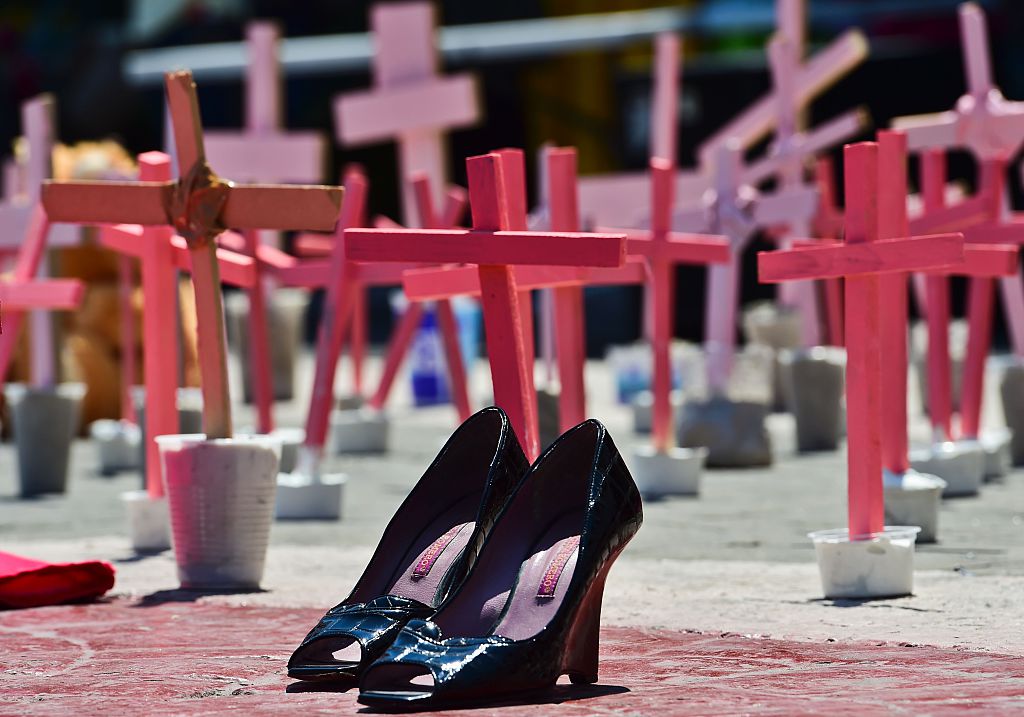 High-heeled shoes from a victim of femicide are pictured next to crosses during a protest against the murder of more than 600 women in the last four years, in Ecatepec, State of Mexico, on March 13 , 2016. AFP PHOTO/RONALDO SCHEMIDT / AFP / RONALDO SCHEMIDT (Photo credit should read RONALDO SCHEMIDT/AFP/Getty Images)