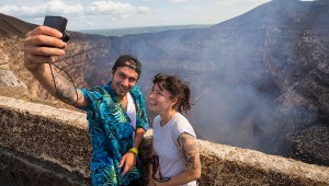 Tourists make a selfie at the crater of the Masaya Volcano in Masaya, some 30km from Managua on May 19, 2016.