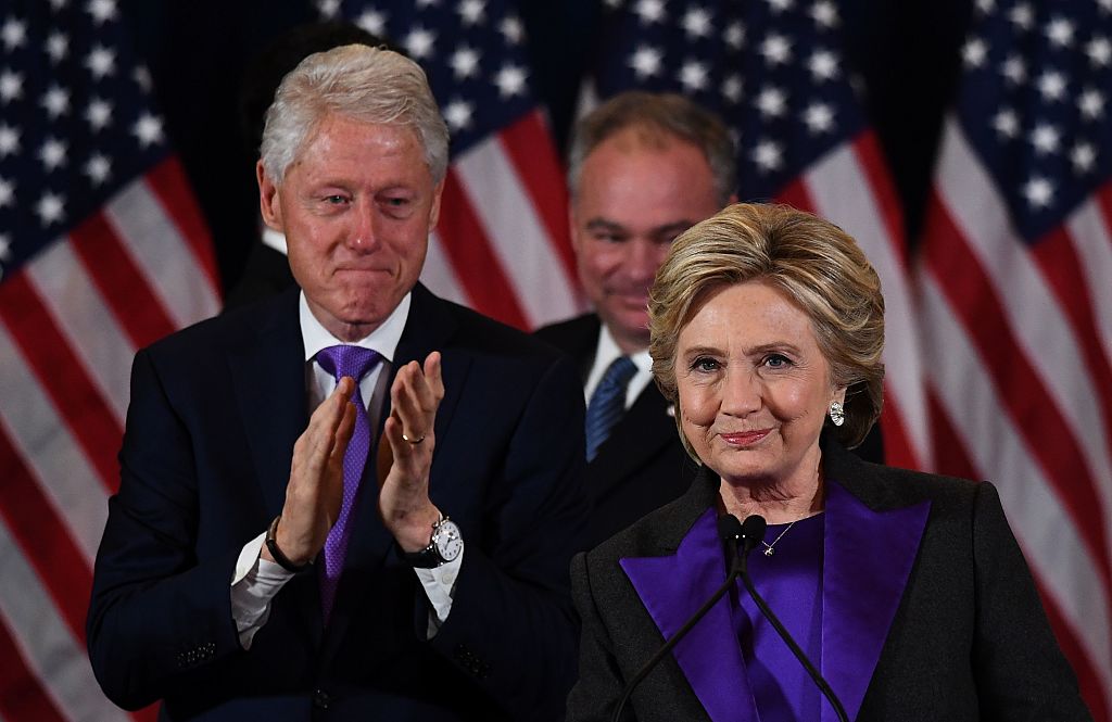 TOPSHOT - US Democratic presidential candidate Hillary Clinton makes a concession speech after being defeated by Republican president-elect Donald Trump as former President Bill Clinton(L) and running mate Tim Kaine look on in New York on November 9, 2016. / AFP / JEWEL SAMAD (Photo credit should read JEWEL SAMAD/AFP/Getty Images)