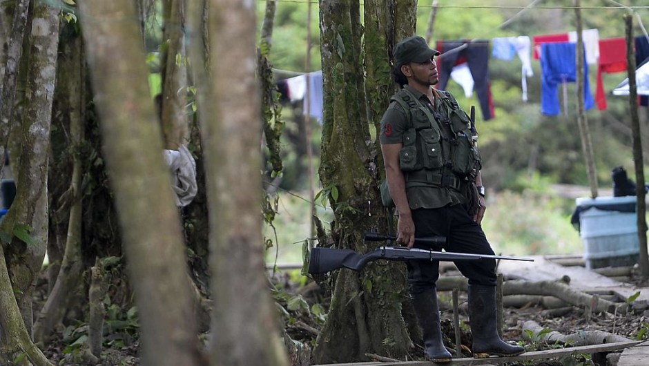FARC guerrilla fighters stand at the Front 34 Alberto Martinez encampment after the New Year's celebration in Vegaez municipality, Antioquia department, Colombia on January 1, 2017. Colombia's Congress on Wednesday passed a law granting an amnesty to the Marxist FARC rebels as part of the country's peace deal, a development the government hailed as "historic." / AFP / STR / RAUL ARBOLEDA (Photo credit should read RAUL ARBOLEDA/AFP/Getty Images)