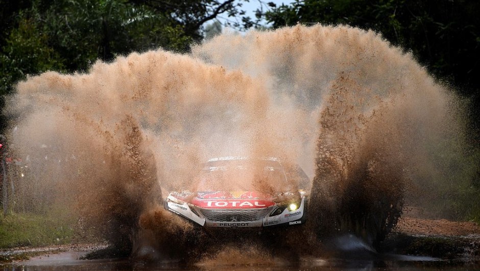 Peugeot's pilot Sebastien Loeb and co-pilot Daniel Elena, both from France, compete during the 2017 Dakar Rally Stage 1 between Asuncion and Resistencia, in Argentina, on January 2, 2017. / AFP / FRANCK FIFE (Photo credit should read FRANCK FIFE/AFP/Getty Images)