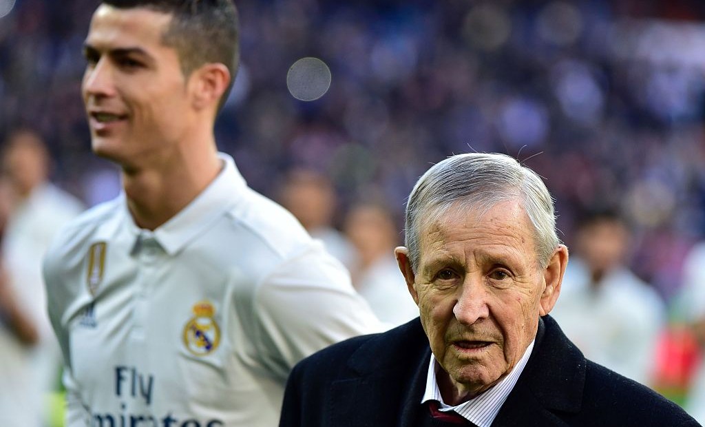 Former French football player Raymond Kopa (R) looks on past Real Madrid's Portuguese forward Cristiano Ronaldo during the handover ceremony of Ronaldo's four Ballon d'Or before the Spanish league football match Real Madrid CF vs Granada FC at the Santiago Bernabeu stadium in Madrid on January 7, 2017. Real Madrid won 5-0. / AFP / GERARD JULIEN (Photo credit should read GERARD JULIEN/AFP/Getty Images)