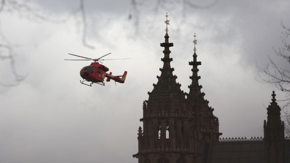 London's air ambulance arrives at the Houses of Parliament in central London on March 22, 2017 during an emergency incident. Britain's Houses of Parliament were in lockdown on Wednesday after staff said they heard shots fired, triggering a security alert. / AFP PHOTO / DANIEL LEAL-OLIVAS (Photo credit should read DANIEL LEAL-OLIVAS/AFP/Getty Images)