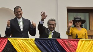 Ecuador's President Rafael Correa (L), President-elect Lenin Moreno (C) and his wife Rocio Gonzalez wave to supporters from the balcony of the Carondelet presidential palace, in Quito on April 3, 2017. Socialist Lenin Moreno on Monday celebrated victory in his bid to extend a decade of leftist rule in Ecuador but faced allegations of voting fraud from his conservative rival. Victory for the 64-year-old Moreno, a wheelchair user and political champion of disability rights, would be good news for the Latin American left, which is in decline. / AFP PHOTO / RODRIGO BUENDIA (Photo credit should read RODRIGO BUENDIA/AFP/Getty Images)