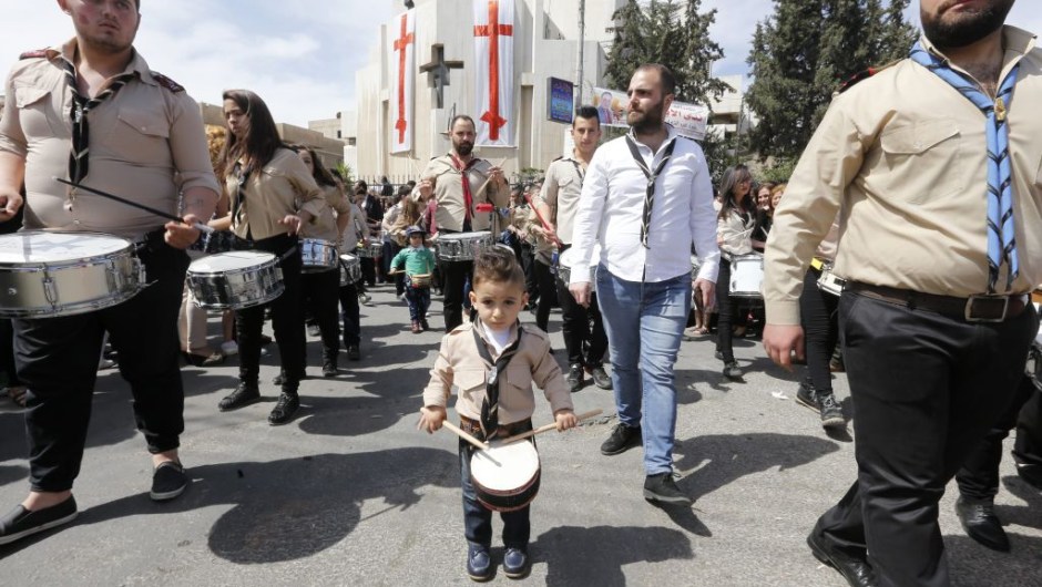 Syrian Christian Orthodox worshippers take part in a parade marking Palm Sunday at the Church of Saint Elias in the Syrian capital Damascus on April 9, 2017. Palm Sunday is the final Sunday of Lent, the beginning of the Holy Week, and commemorates the triumphant arrival of Jesus Christ in Jerusalem, days before he was crucified. / AFP PHOTO / Louai Beshara (Photo credit should read LOUAI BESHARA/AFP/Getty Images)