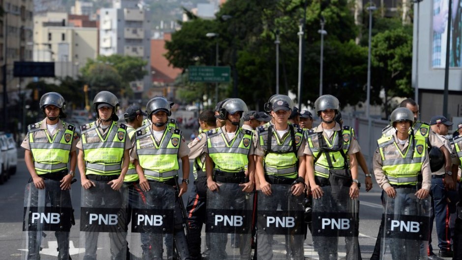 Riot police forces are deployed waiting for demonstrations in Caracas on April 19, 2017. Venezuela braced for rival demonstrations Wednesday for and against President Nicolas Maduro, whose push to tighten his grip on power has triggered waves of deadly unrest that have escalated the country's political and economic crisis. / AFP PHOTO / FEDERICO PARRA (Photo credit should read FEDERICO PARRA/AFP/Getty Images)