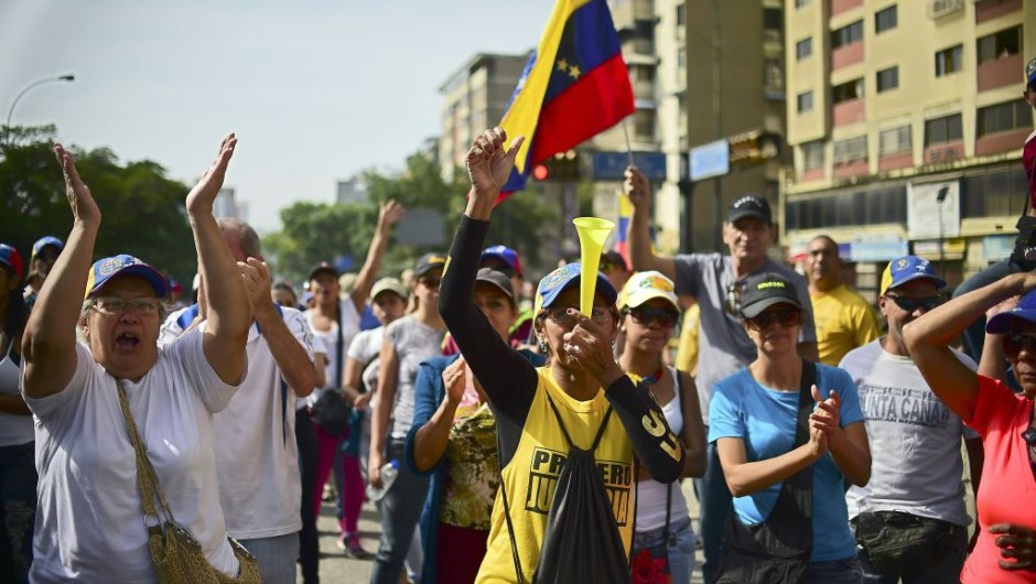 Demonstrators against Nicolas Maduro's government start gathering at the east side of Caracas on April 19, 2017. Venezuela braced for rival demonstrations Wednesday for and against President Nicolas Maduro, whose push to tighten his grip on power has triggered waves of deadly unrest that have escalated the country's political and economic crisis. / AFP PHOTO / RONALDO SCHEMIDT (Photo credit should read RONALDO SCHEMIDT/AFP/Getty Images)