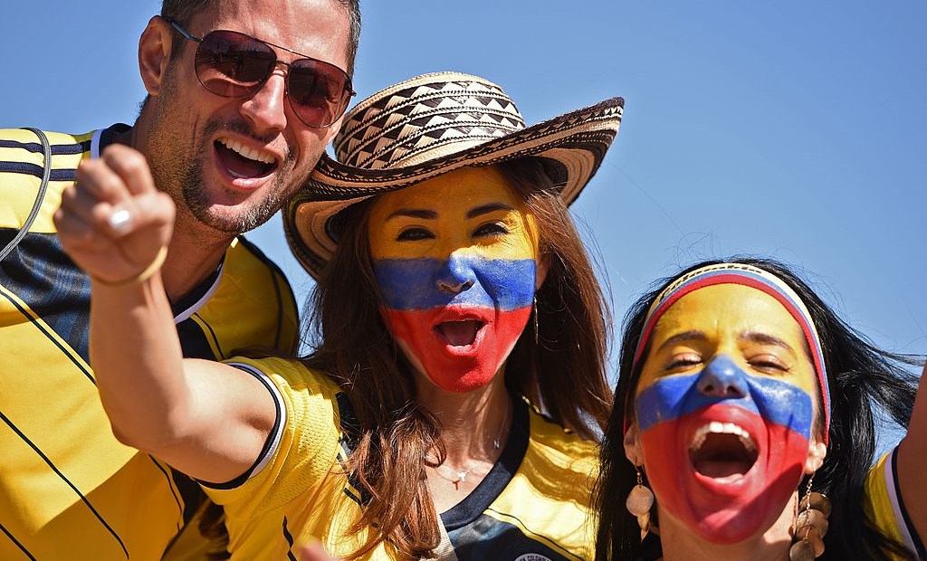 Colombian fans cheer for their team as they arrive to attend the Group C football match between Colombia and Ivory Coast at the Mane Garrincha National Stadium in Brasilia during the 2014 FIFA World Cup on June 19, 2014. AFP PHOTO / PEDRO UGARTE (Photo credit should read PEDRO UGARTE/AFP/Getty Images)