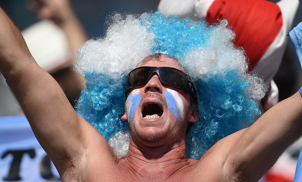 An Argentinian fan with his face painted in the colours of his national flag cheers prior to the Group F football match between Argentina and Iran at the Mineirao Stadium in Belo Horizonte during the 2014 FIFA World Cup in Brazil on June 21, 2014. AFP PHOTO / PEDRO UGARTE (Photo credit should read PEDRO UGARTE/AFP/Getty Images)