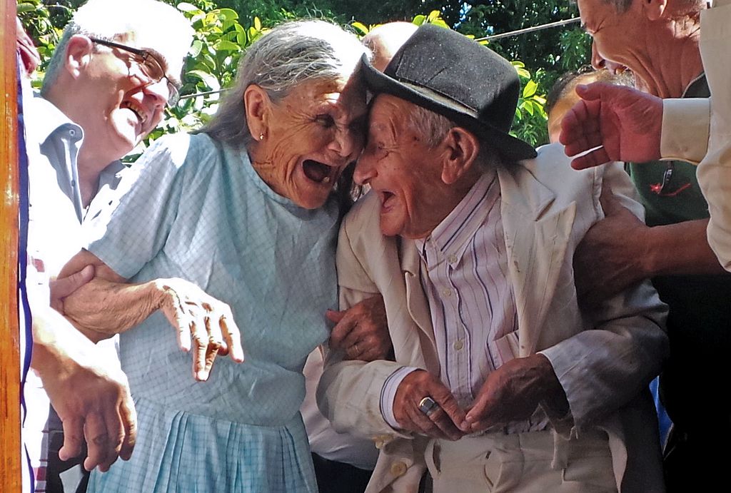Paraguayan Anacleto Escobar (R), veteran of the Chaco War (1932-1935) fought between Paraguay and Bolivia, and his wife Cayetana Roman, smile during a ceremony coinciding with his 100th birthday in which they received a house -- the first in their lives they own -- as a gift for his merits, in Neembucu, Paraguay, on January 7, 2015. The event was organized by the governor of the state of Neembucu, Carlos Silva, to honour Escobar. AFP PHOTO / STR (Photo credit should read --/AFP/Getty Images)