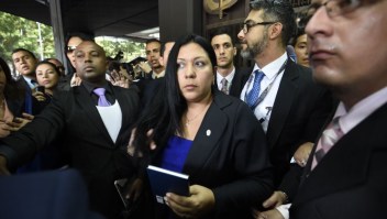 Venezuela's Supreme Court-appointed deputy Attorney General, Katherine Haringhton, is denied entry to the Public Ministry in Caracas on July 6, 2017. A political and economic crisis in the oil-producing country has spawned often violent demonstrations by protesters demanding President Nicolas Maduro's resignation and new elections. The unrest has left 91 people dead since April 1. / AFP PHOTO / Juan BARRETO (Photo credit should read JUAN BARRETO/AFP/Getty Images)