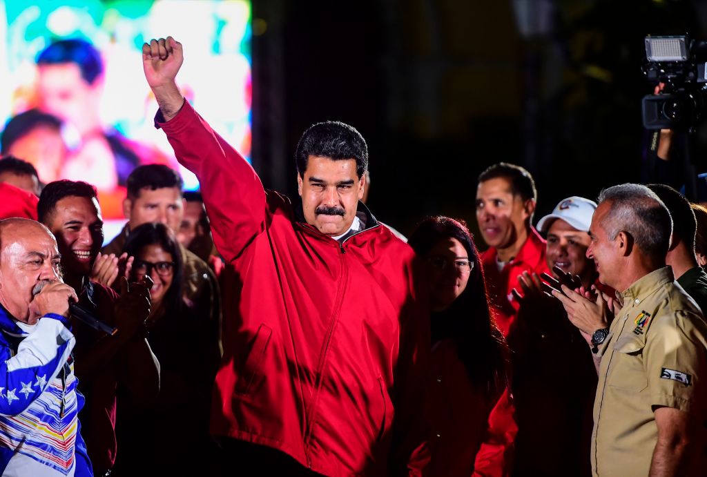 TOPSHOT - Venezuelan president Nicolas Maduro celebrates the results of "Constituent Assembly", in Caracas, on July 31, 2017. Deadly violence erupted around the controversial vote, with a candidate to the all-powerful body being elected shot dead and troops firing weapons to clear protesters in Caracas and elsewhere. / AFP PHOTO / RONALDO SCHEMIDT (Photo credit should read RONALDO SCHEMIDT/AFP/Getty Images)
