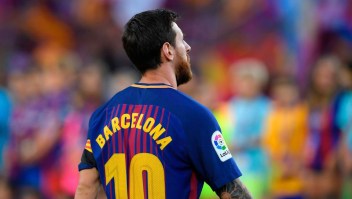 Barcelona's Argentinian forward Lionel Messi stands with his jersey reading "Barcelona" instead of his name to pay tribute to the victims of the Barcelona and Cambrils attacks before the Spanish league footbal match FC Barcelona vs Real Betis at the Camp Nou stadium in Barcelona on August 20, 2017. Drivers have ploughed on August 17, 2017 into pedestrians in two quick-succession, separate attacks in Barcelona and another popular Spanish seaside city, leaving 14 people dead and injuring more than 100 others. / AFP PHOTO / LLUIS GENE (Photo credit should read LLUIS GENE/AFP/Getty Images)