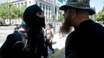 An Antifa demonstrator has a heated exchange with a pro-Trump supporter during the Denver March Against Sharia Law in Denver, Colorado on June 10, 2017. The march was supported by two right-wing groups, The Proud Boys, and Bikers Against Radical Islam. Police kept the counter protestors separated during the rally which was held in front of the Colorado State Capital. The march was one of many held throughout the U.S. opposing Sharia law, and was viewed by many as promoting both Islamophobia and racism. / AFP PHOTO / Jason Connolly (Photo credit should read JASON CONNOLLY/AFP/Getty Images)