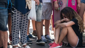 BARCELONA, SPAIN - AUGUST 18: A woman weeps as she sits on Las Ramblas near the scene of yesterday's terrorist attack, on August 18, 2017 in Barcelona, Spain. Fourteen people were killed and dozens injured when a van hit crowds in the Las Ramblas area of Barcelona on Thursday. Spanish police have also killed five suspected terrorists in the town of Cambrils to stop a second terrorist attack. (Photo by Carl Court/Getty Images)