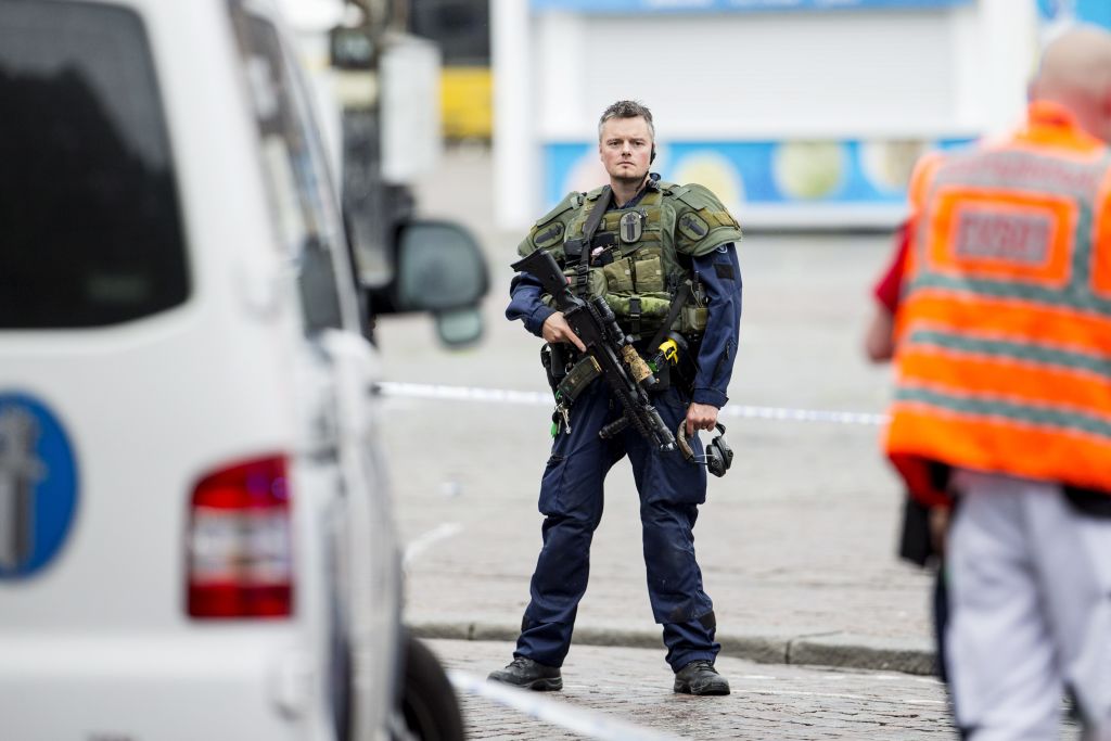 An armed police officer stands guard at the Turku Market Square in the Finnish city of Turku where several people were stabbed on August 18, 2017. One person was killed and eight were injured in a stabbing spree in the Finnish city of Turku, a hospital director said, after police shot one suspect and warned several others could be at large. / AFP PHOTO / Lehtikuva / Roni Lehti / Finland OUT (Photo credit should read RONI LEHTI/AFP/Getty Images)