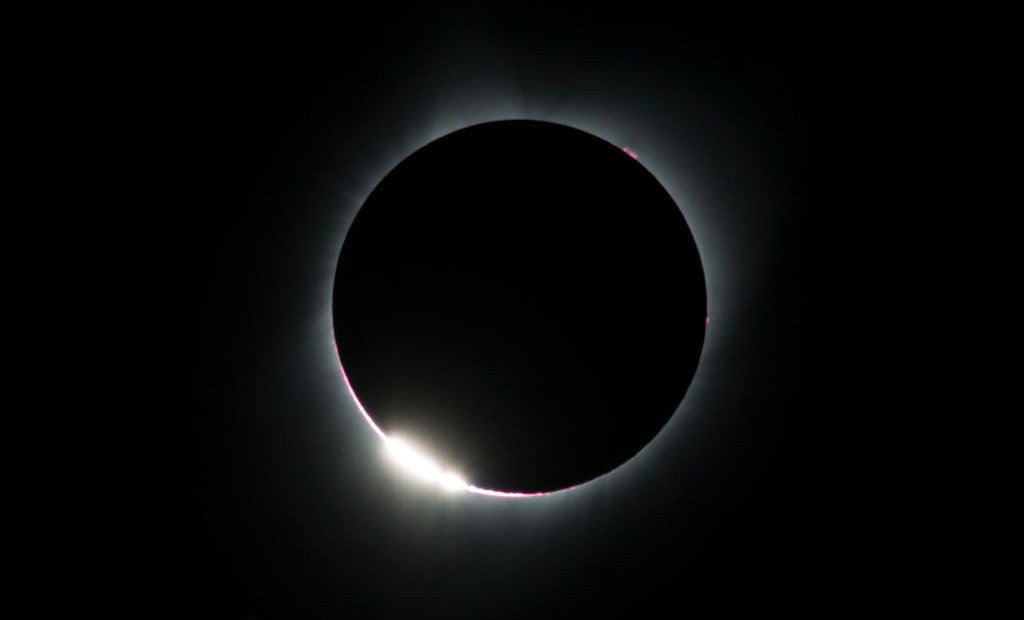 TOPSHOT - The "diamond ring effect" is seen during a total solar eclipse as seen from the Lowell Observatory Solar Eclipse Experience on August 21, 2017 in Madras, Oregon. Millions will be able to witness the total eclipse that will touch land in Oregon on the west coast and continue through South Carolina on the east coast. / AFP PHOTO / STAN HONDA (Photo credit should read STAN HONDA/AFP/Getty Images)