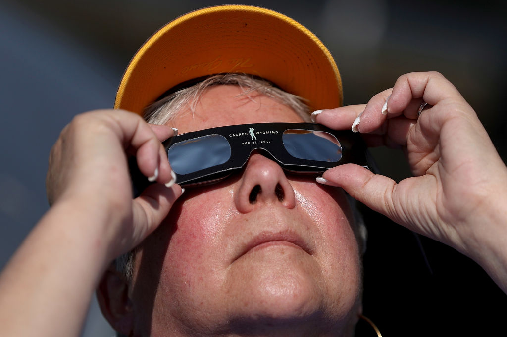CASPER, WY - AUGUST 21: A spectator watches the solar eclipse at South Mike Cedar Park on August 21, 2017 in Casper, Wyoming.  Millions of people are concentrated in areas in the United States 