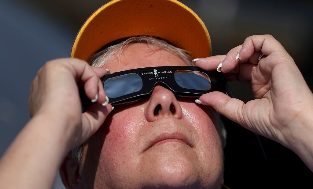 CASPER, WY - AUGUST 21: A visitor looks at the solar eclipse at South Mike Sedar Park on August 21, 2017 in Casper, Wyoming. Millions of people have flocked to areas of the U.S. that are in the "path of totality" in order to experience a total solar eclipse. During the event, the moon will pass in between the sun and the Earth, appearing to block the sun. (Photo by Justin Sullivan/Getty Images)