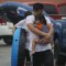 HOUSTON, TX - AUGUST 27: Mario Qua holds Wilson Qua as they evacuate their flooded home after the area was inundated with flooding from Hurricane Harvey on August 27, 2017 in Houston, Texas. Harvey, which made landfall north of Corpus Christi late Friday evening, is expected to dump upwards to 40 inches of rain in Texas over the next couple of days. (Photo by Joe Raedle/Getty Images)
