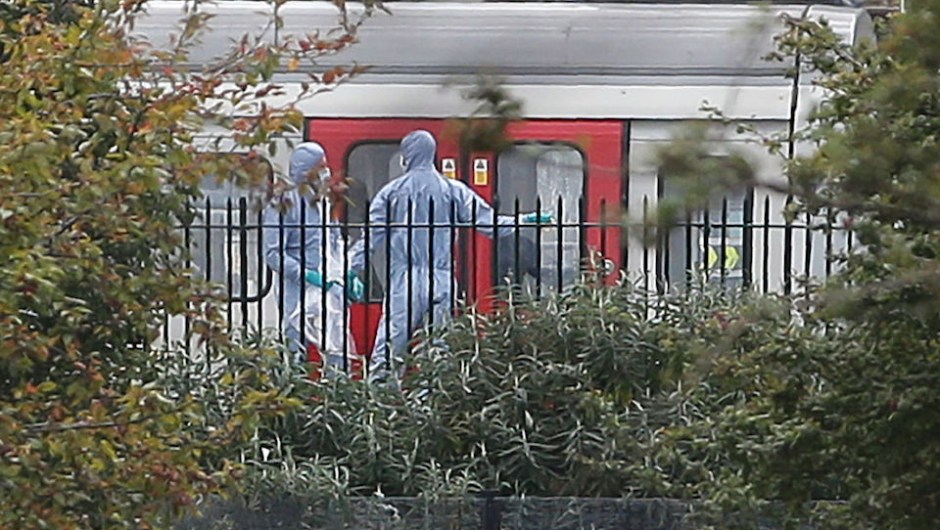 Police forensics officers works alongside an underground tube train at a platform at Parsons Green underground tube station in west London on September 15, 2017, following an incident on an underground tube carriage at the station. British police are treating an incident on a London Underground train on Friday as an act of terrorism, saying "a number of people" had been injured. "Terrorist incident declared at Parsons Green Underground Station," police said in a statement. / AFP PHOTO / Daniel LEAL-OLIVAS (Photo credit should read DANIEL LEAL-OLIVAS/AFP/Getty Images)