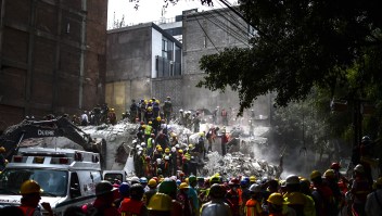 Rescue workers take part in the search for survivors and bodies in Mexico City on September 21, 2017, two days after a strong quake hit central Mexico. A powerful 7.1 earthquake shook Mexico City on Tuesday, causing panic among the megalopolis' 20 million inhabitants on the 32nd anniversary of a devastating 1985 quake. / AFP PHOTO / RONALDO SCHEMIDT (Photo credit should read RONALDO SCHEMIDT/AFP/Getty Images)
