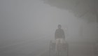 An Indian labourer drives a rickshaw amid heavy smog in New Delhi on November 8, 2017. Delhi shut all primary schools on November 8 as pollution levels hit nearly 30 times the World Health Organization safe level, prompting doctors in the Indian capital to warn of a public health emergency. Dense grey smog shrouded the roads of the world's most polluted capital, where many pedestrians and bikers wore masks or covered their mouths with handkerchiefs and scarves. / AFP PHOTO / SAJJAD HUSSAIN (Photo credit should read SAJJAD HUSSAIN/AFP/Getty Images)