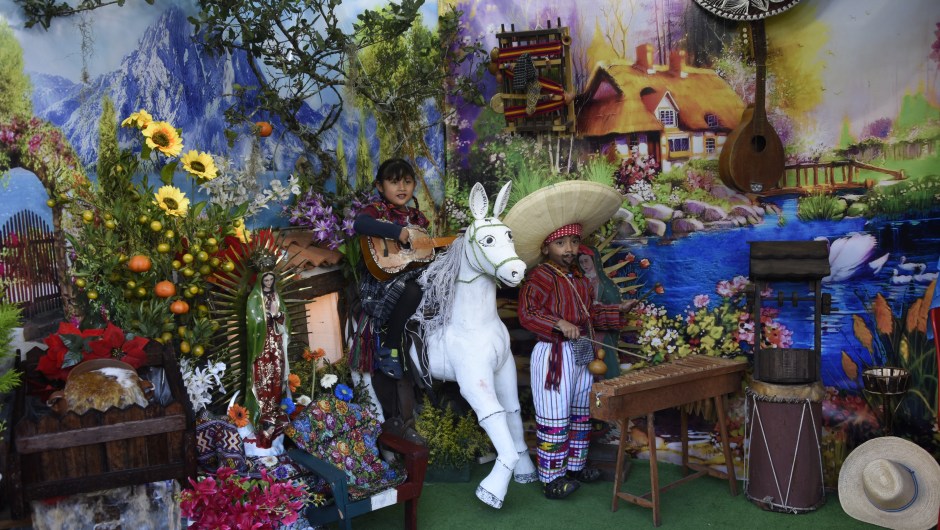 Children play guitar and marimba during the celebration of the apparition of the Virgin of Guadalupe to indigenous peasant Juan Diego in Mexico in 1531, at the basilica of the Virgin of Guadalupe, in downtown Guatemala City, on December 12, 2017. / AFP PHOTO / Johan ORDONEZ (Photo credit should read JOHAN ORDONEZ/AFP/Getty Images)
