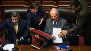 Peruvian President Pedro Pablo Kuczynski (2-R) is pictured next to the President of the Congress Luis Galarreta (L) after delivering a speech before the Peruvian National Congress in Lima, while the opposition, demands he steps down or face impeachment over graft allegations linked to Brazilian construction giant Odebrecht, on December 21, 2017. If Peru's Congress sets the impeachment process in motion it would make Kuczynski the highest-profile political figure to be punished in the expanding scandal surrounding Odebrecht, a Brazilian engineering and construction firm that admitted to paying millions of dollars in bribes in several Latin American countries to secure public works contracts. / AFP PHOTO / ERNESTO BENAVIDES (Photo credit should read ERNESTO BENAVIDES/AFP/Getty Images)