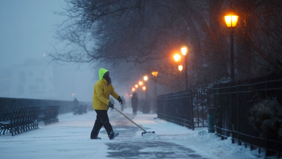 NEW YORK, NY - JANUARY 04: A worker clears snow on the Brooklyn Promenade, on January 4, 2018 in the Brooklyn borough of New York City. As a major winter storm moves up the Northeast corridor, New York City is under a winter storm warning and forecasts are predicting six to eight inches of snow. (Photo by Drew Angerer/Getty Images)