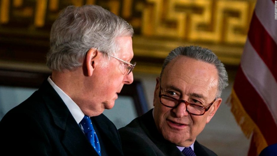 WASHINGTON, DC - JANUARY 17: Senate Majority Leader Mitch McConnell (R-KY) (L) and Senate Minority Leader Chuck Schumer (D-NY) talk during the congressional Gold Medal ceremony for former Senate Majority Leader Bob Dole at the U.S. Capitol January 17, 2018 in Washington D.C. (Photo by Al Drago-Pool/Getty Images)