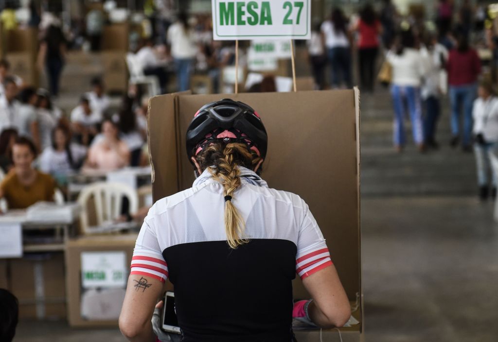 A woman votes at a polling station in Medellin, Antioquia Department, during parliamentary elections in Colombia on March 11, 2018. Colombians went to the polls Sunday to elect a new Congress with a resurgent right, bitterly opposed to a peace deal that allows leftist former rebels to participate, expected to poll strongly. The election is set to be the calmest in half a century of conflict in Colombia, with the former rebel movement FARC spurning jungle warfare for politics, and the ELN -- the country's last active rebel group -- observing a ceasefire. / AFP PHOTO / Joaquin SARMIENTO (Photo credit should read JOAQUIN SARMIENTO/AFP/Getty Images)