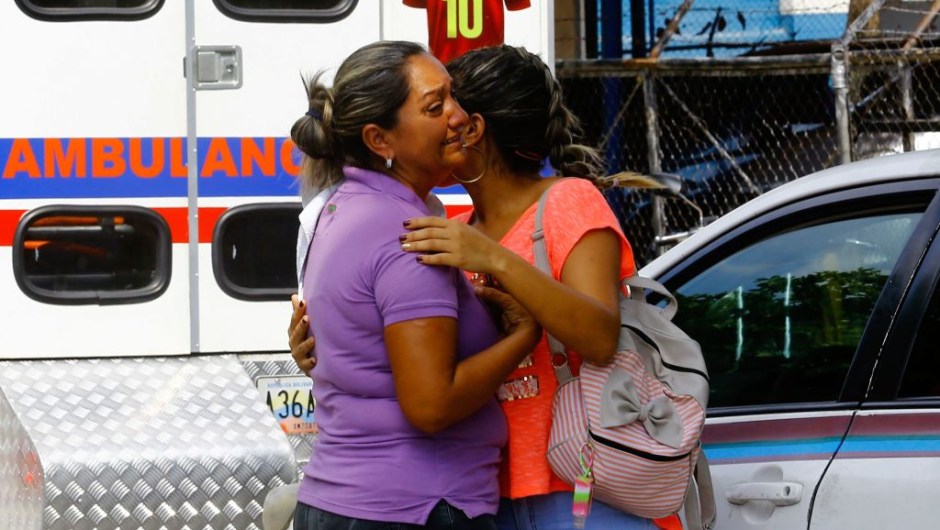 Relatives of prisoners cry in front of a police station in Valencia on March 28, 2018, after a fire engulfed police holding cells that resulted in the deaths of 68 people. A total of 68 people died on March 28 during an attempted jailbreak in Venezuela after a fire engulfed police holding cells in one of the worst tragedies in years in a notoriously violent and overcrowded prison system. / AFP PHOTO / Katherine ORTIZ / The erroneous mention[s] appearing in the metadata of this photo by Katherine ORTIZ has been modified in AFP systems in the following manner: [2018] instead of [2017]. Please immediately remove the erroneous mention[s] from all your online services and delete it (them) from your servers. If you have been authorized by AFP to distribute it (them) to third parties, please ensure that the same actions are carried out by them. Failure to promptly comply with these instructions will entail liability on your part for any continued or post notification usage. Therefore we thank you very much for all your attention and prompt action. We are sorry for the inconvenience this notification may cause and remain at your disposal for any further information you may require. (Photo credit should read KATHERINE ORTIZ/AFP/Getty Images)