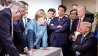 Foto de Merkel y Trump desata concurso de subtítulos