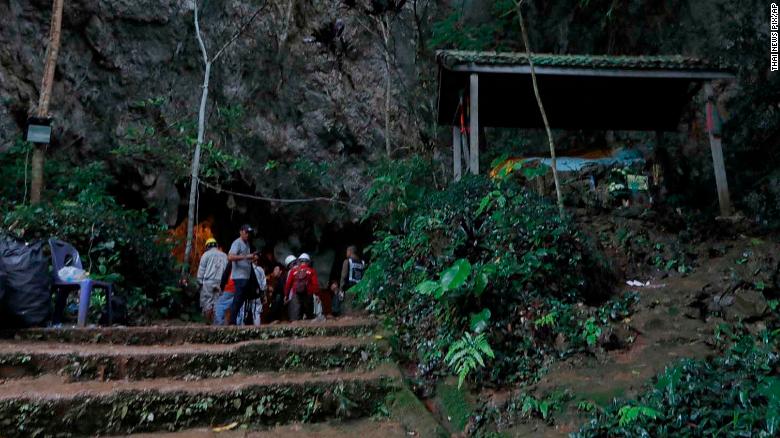 Rescue teams gather at the entrance of a deep cave where a group of boys went missing in Chiang Rai, northern Thailand, Monday, June 25, 2018. Officials say multiple attempts to locate the 12 boys and their soccer coach missing in a flooded cave in northern Thailand for nearly two days have failed, but that they will keep trying. (Thai News Pix via AP)