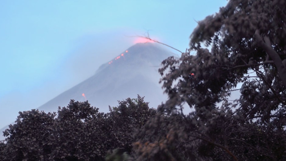 The Fuego Volcano in eruption, seen from Los Lotes, Rodeo, in Escuintla about 35km south of Guatemala City, on June 4, 2018. - Emergency workers will resume the search on Monday for Guatemalans missing after the eruption of the Fuego volcano, which belched out clouds of ash and flows of lava and left at least 25 people dead. (Photo by Johan ORDONEZ / AFP) (Photo credit should read JOHAN ORDONEZ/AFP/Getty Images)