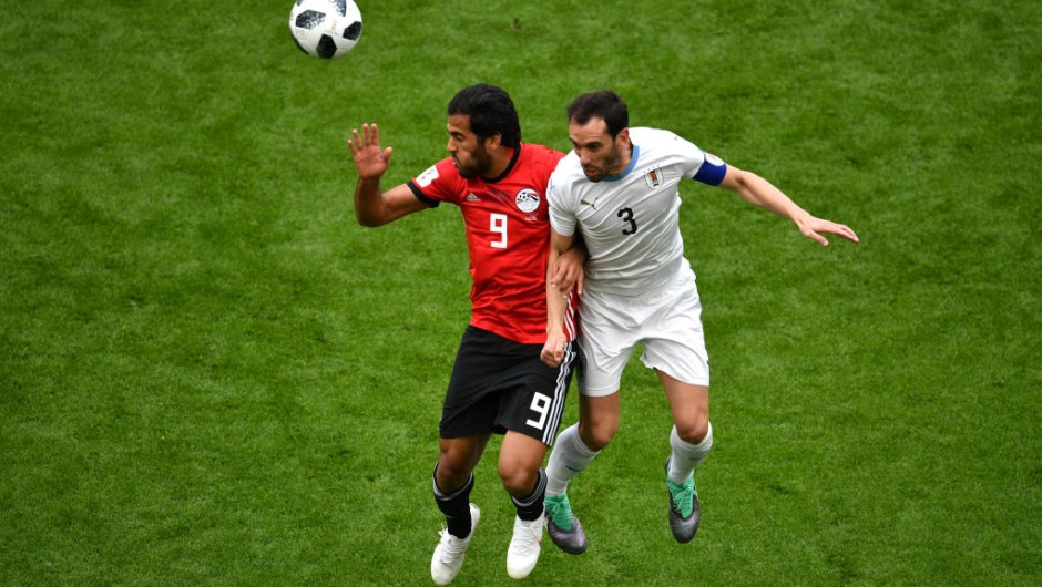YEKATERINBURG, RUSSIA - JUNE 15: Diego Godin of Uruguay battles for possession with Marwan Mohsen of Egypt during the 2018 FIFA World Cup Russia group A match between Egypt and Uruguay at Ekaterinburg Arena on June 15, 2018 in Yekaterinburg, Russia. (Photo by Dan Mullan/Getty Images)